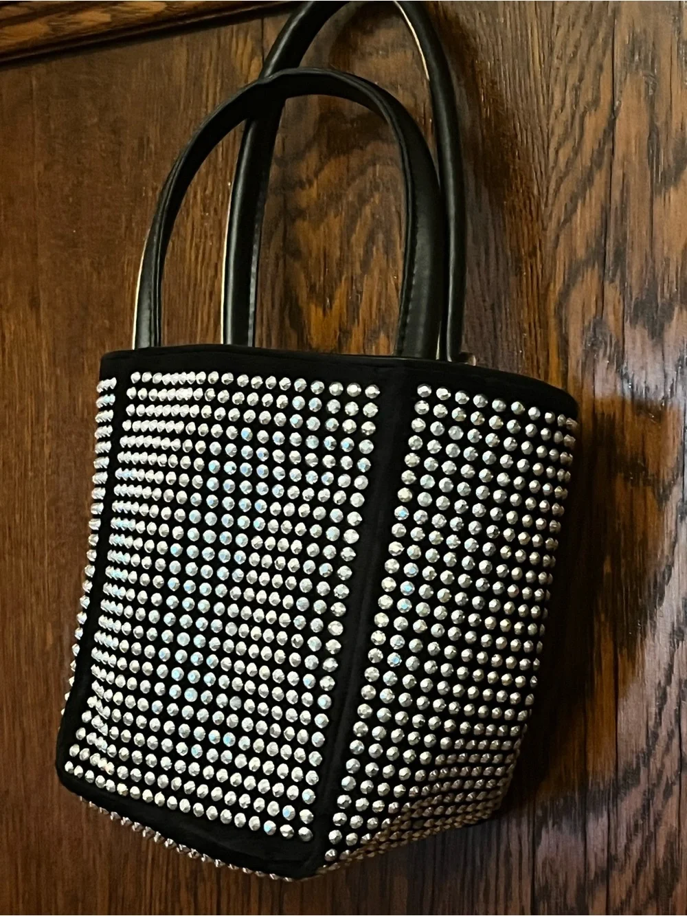 Fun and funky black and silver studded bucket bag. 80s and 90s studio 51 vibes!